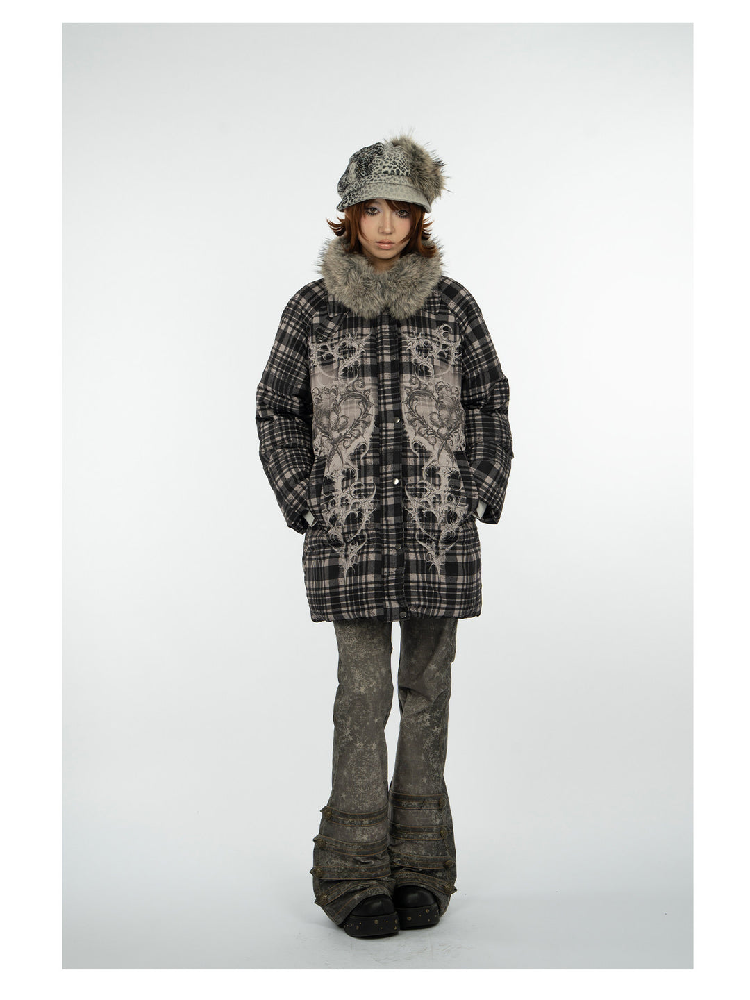 4RE1GN BEARHEART plaid long down coat in brown multicolor — full-length modeled view with hands in pockets and printed trousers