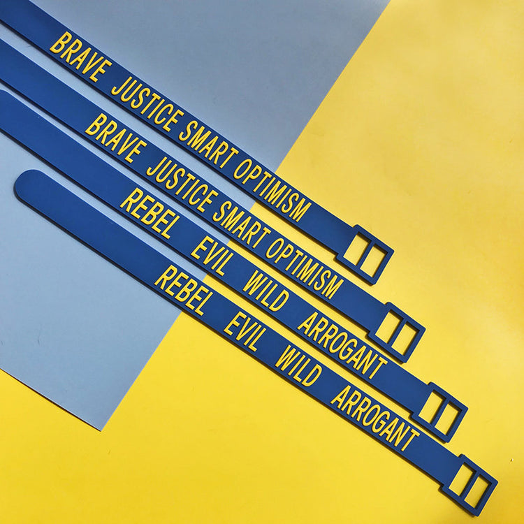 EOH-STUDIO BTBM blue BRAVE and EVIL silicone straps with raised yellow wording.