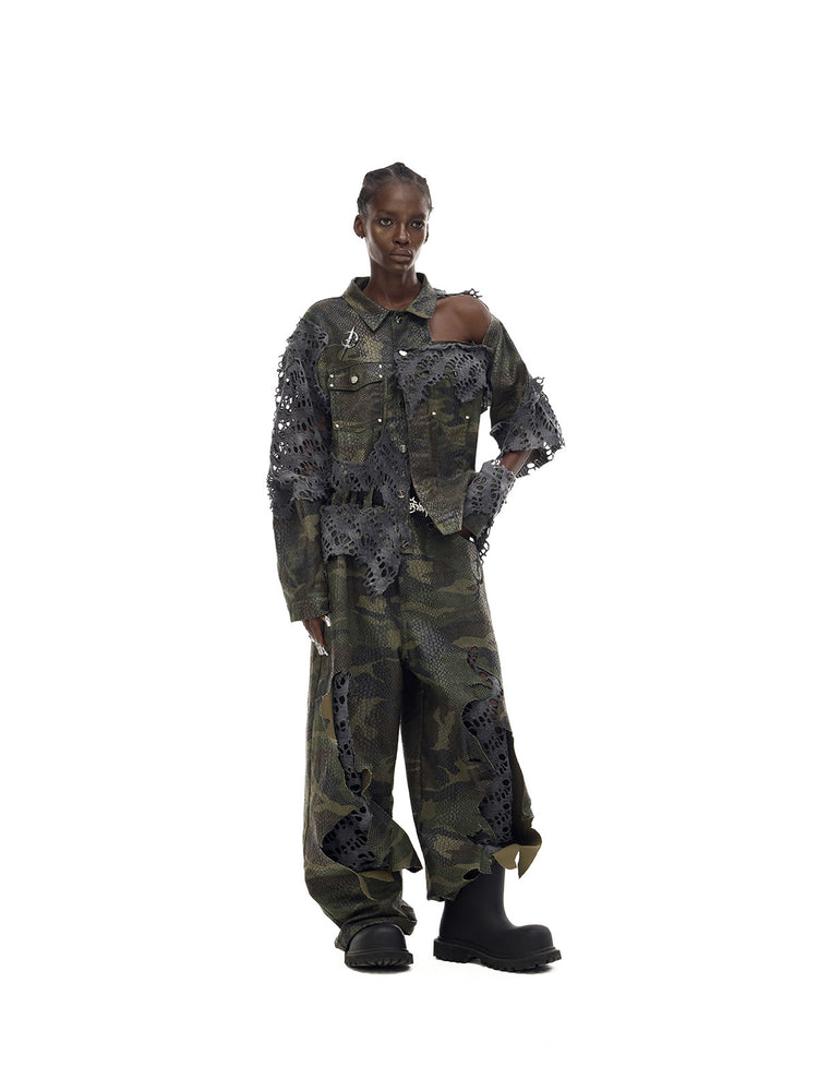 PINKSPINK ELECTRIC MOON distressed camouflage denim jacket — full-length angled modeled view styled with matching camouflage jeans