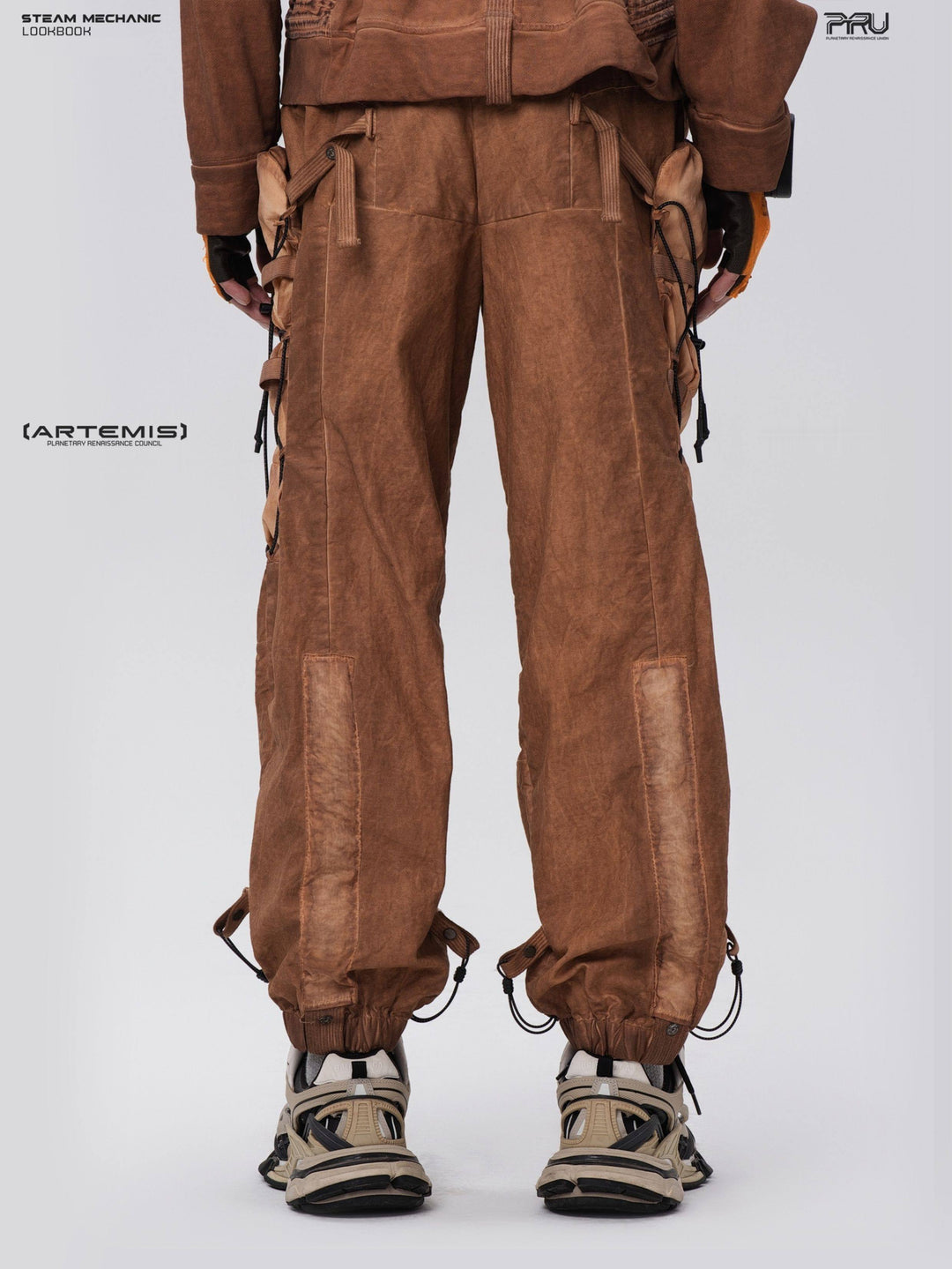 PIONEER cargo pants in Corona Orange, modeled rear three-quarter view