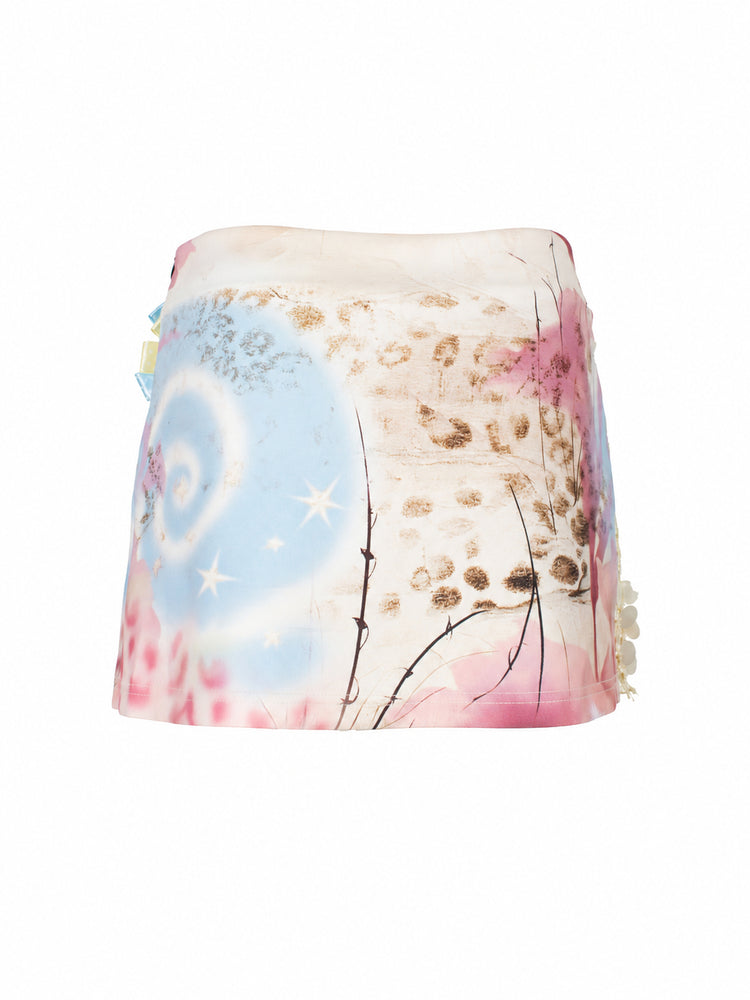 4RE1GN DREAM GARDEN sequin-panel mini skirt in pink multicolor — back garment-only view showing the pastel floral and star print