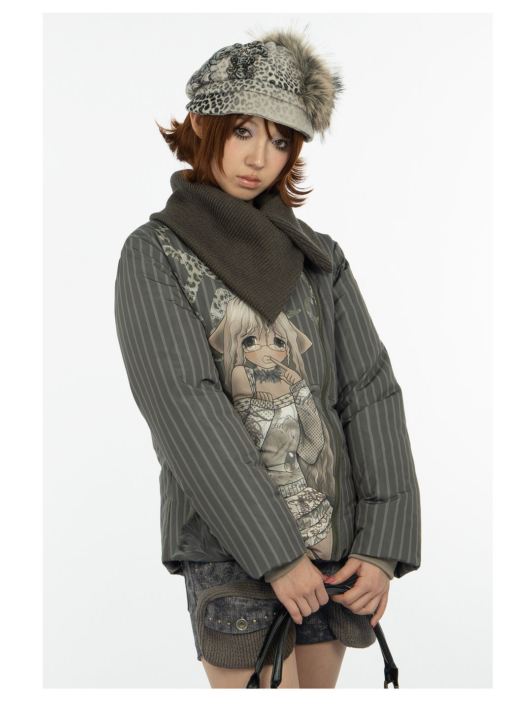 4RE1GN COMIC STRIPE asymmetric-collar down jacket in olive green — close front modeled view holding a bag
