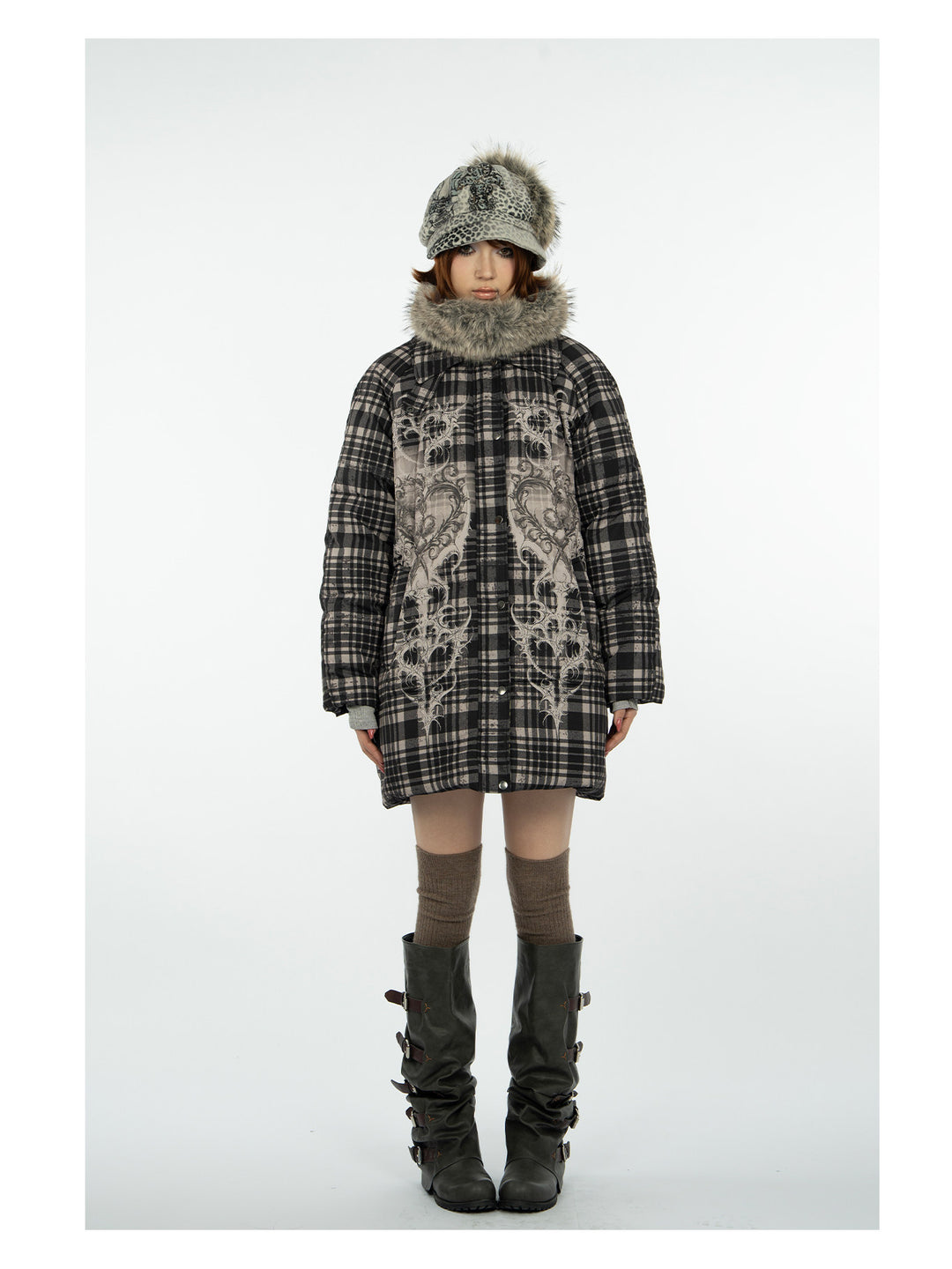 4RE1GN BEARHEART plaid long down coat in brown multicolor — front modeled view with arms relaxed and tall boots