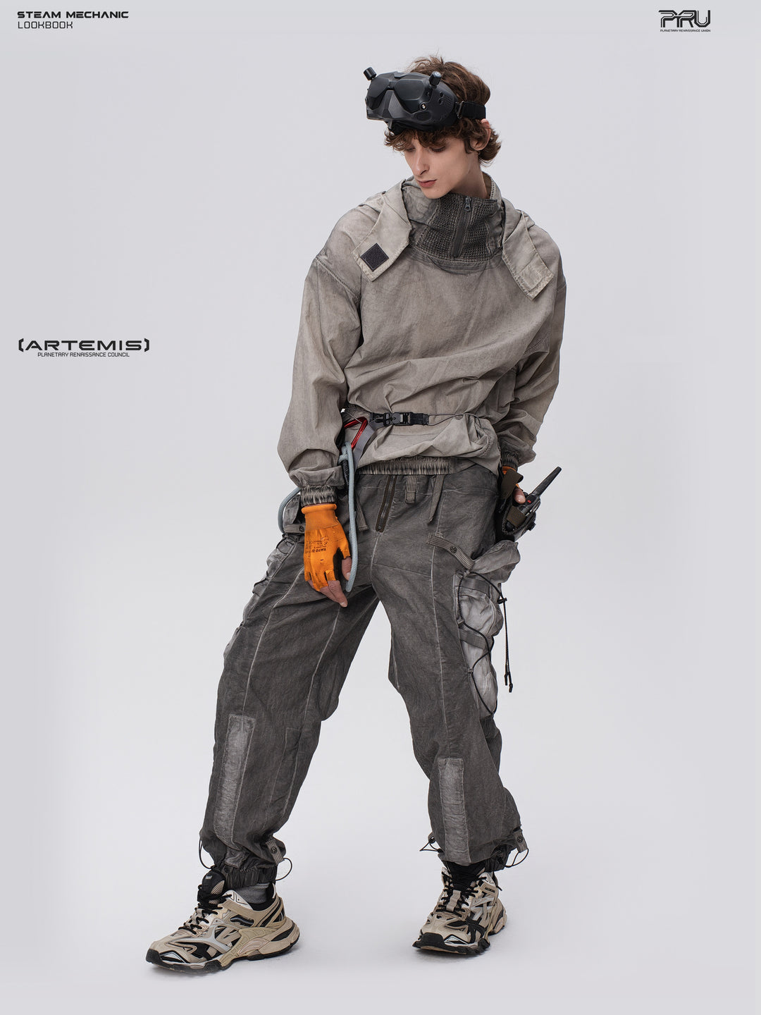 PIONEER meteorite-gray mesh hoodie, full-body angled pose with the model looking down