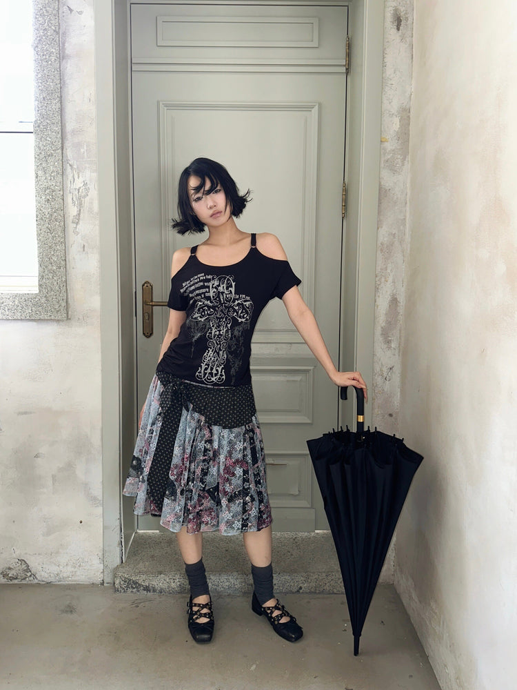 4RE1GN CROSS RIBBON jacquard lace layered skirt in multicolor — full-length front modeled view beside an umbrella