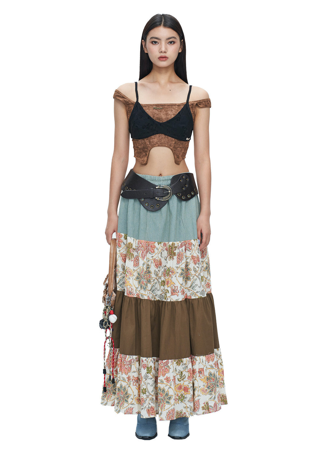 NEXT PASSPORT wasteland-brown shark-pleat vest and mini skirt — final modeled view