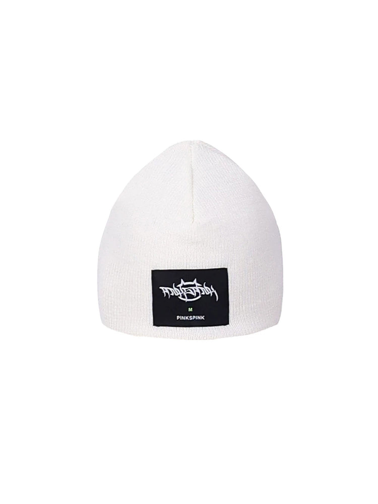 PINKSPINK GALAXY LIGHTNING logo knit beanie — white knit beanie with black label patch, product-only view