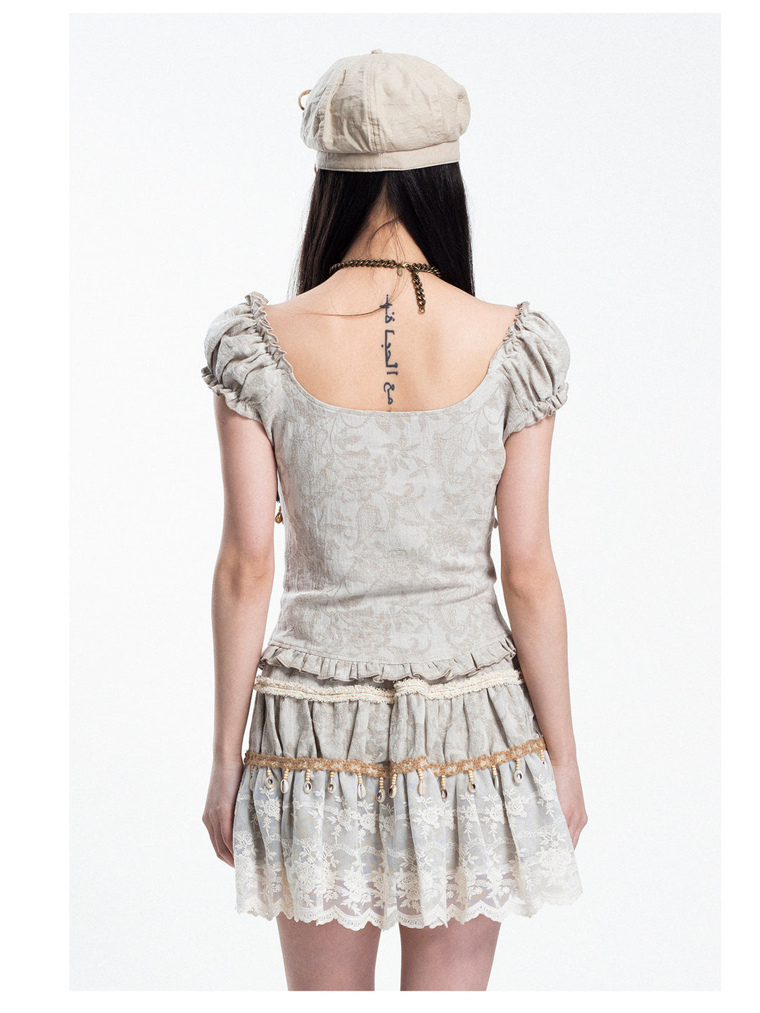 4RE1GN SHELL jacquard blouse and lace skirt separates in ivory — rear modeled view with hair lifted to show the blouse back