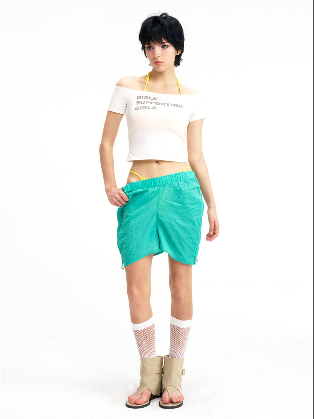 NEXT PASSPORT side-ruched drawstring mini shorts in green, relaxed-length front view