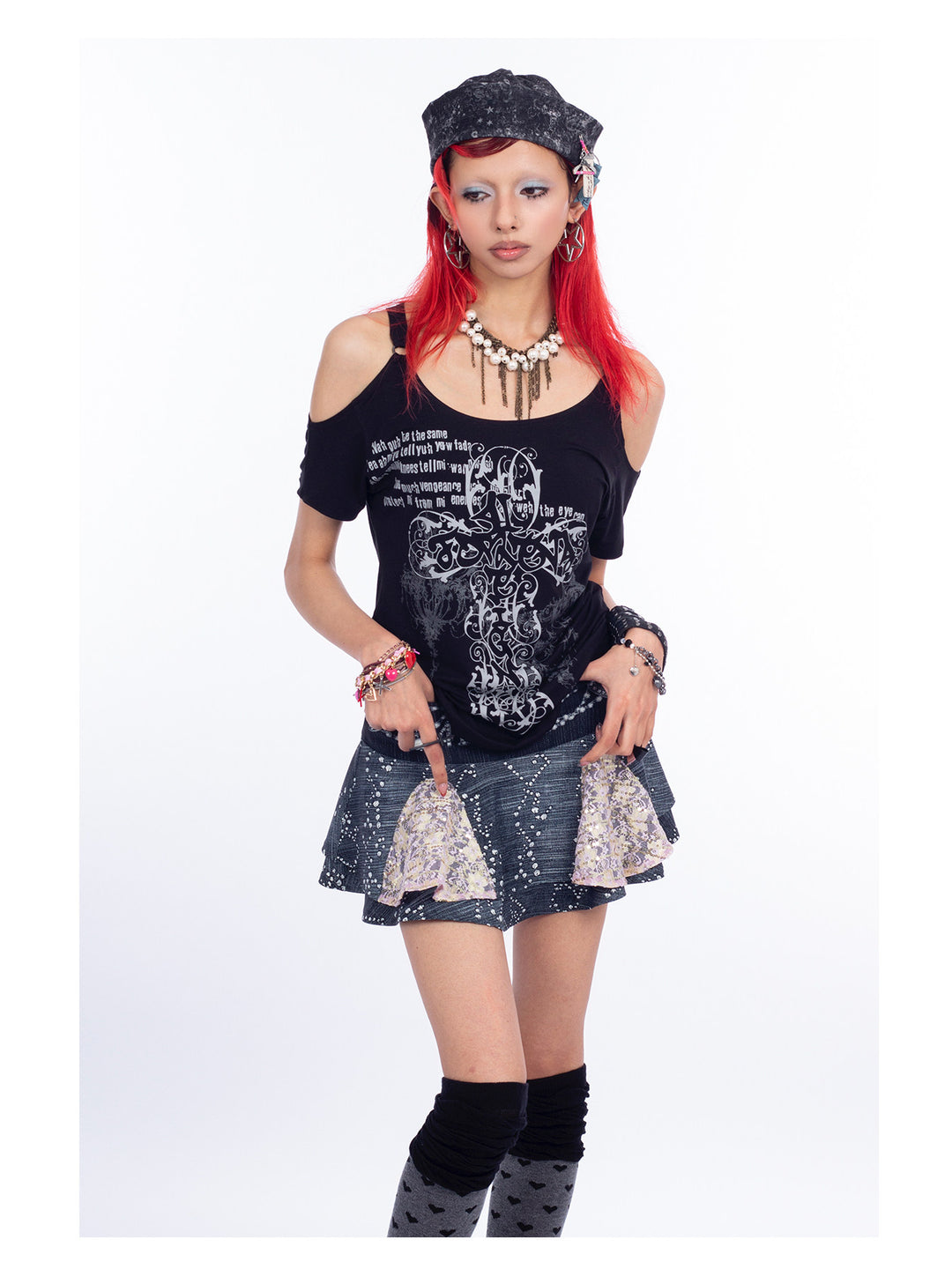 4RE1GN CROSS SCRIPT cold-shoulder tee in black — close front modeled view styled with the MYSTIC hat