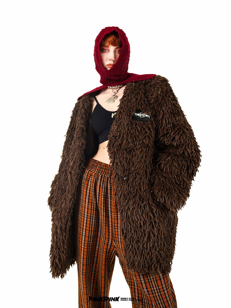 PINKSPINK ELECTRIC THORN embroidered knit balaclava in burgundy — three-quarter modeled view with the caramel shaggy jacket