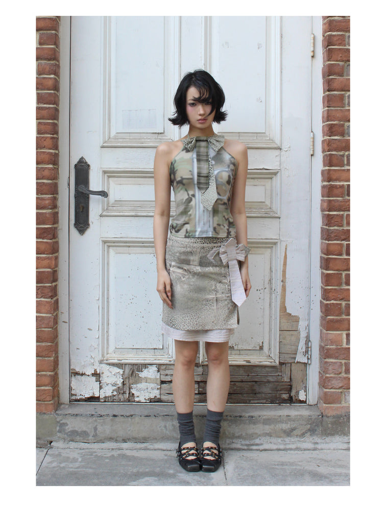 4RE1GN CROSS LEOPARD bow-detail layered skirt in beige multicolor — full-length front modeled view with the head tilted