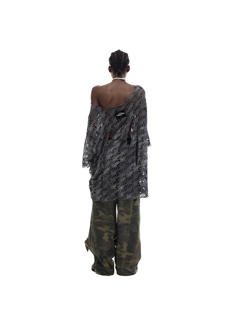 PINKSPINK DOUBLE STACK distressed camouflage wide-leg jeans — back full-length modeled view with an asymmetric gray top