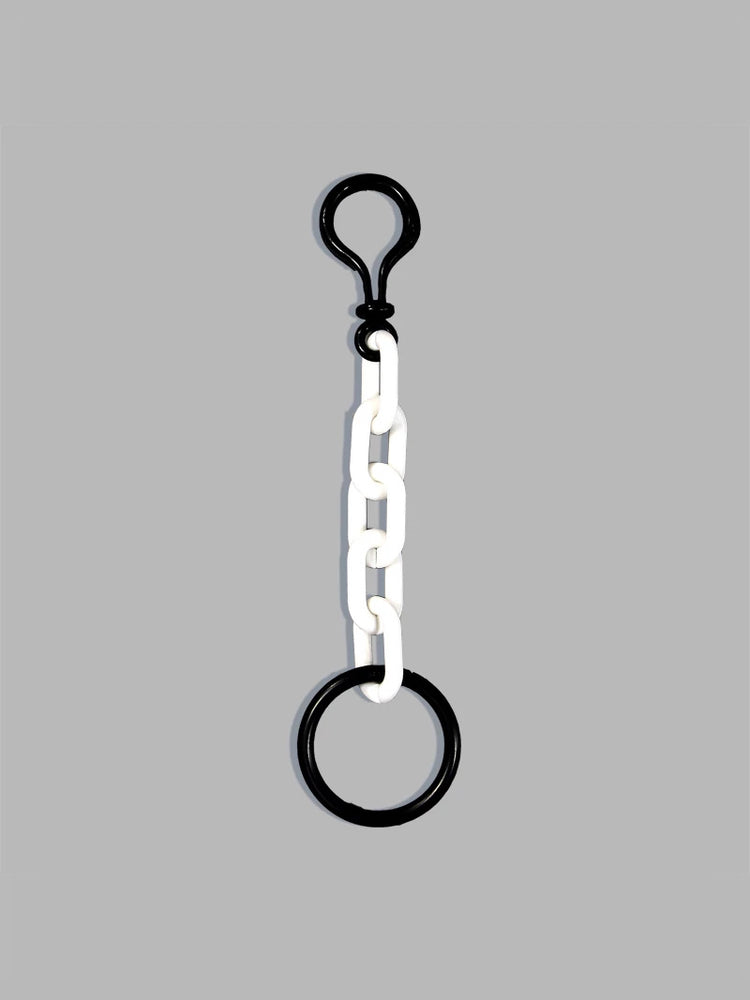 COLLATERAL — keyring white with black metal hardware