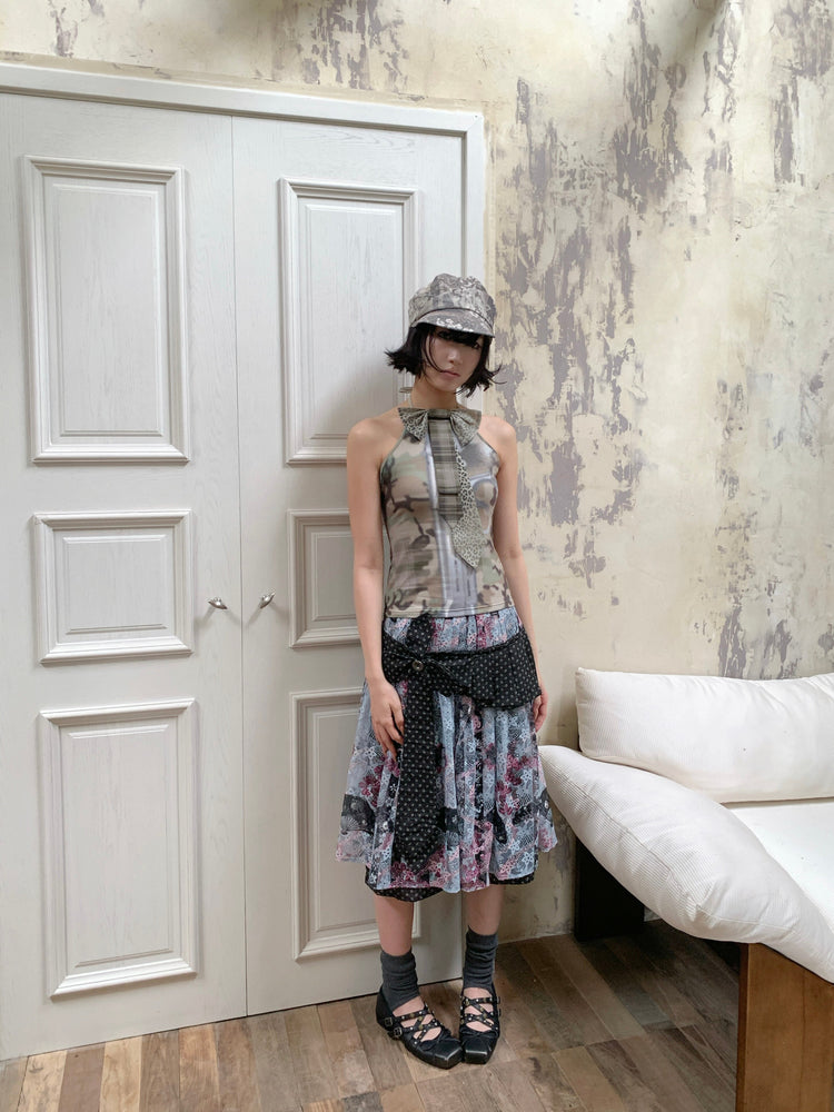 4RE1GN CROSS RIBBON jacquard lace layered skirt in multicolor — full-length modeled view styled with a camouflage halter top