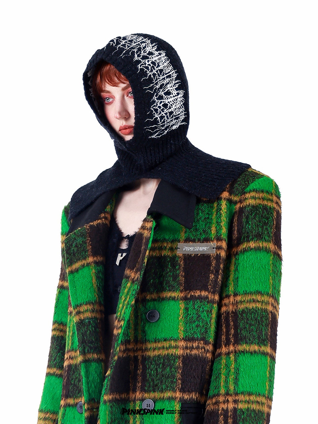 PINKSPINK ELECTRIC THORN embroidered knit balaclava in black — front modeled close-up with a green plaid coat