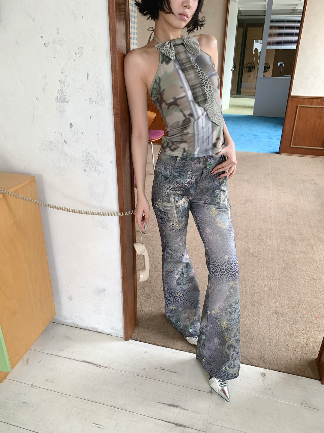4RE1GN DEAR NINA camouflage tie-neck halter top in camo green — front modeled detail showing the necktie and tool print