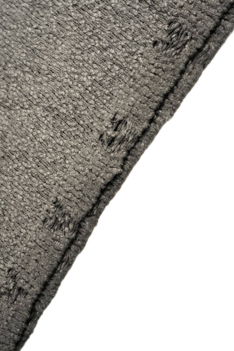 ARTEMIS distressed reversible knit sweater, close-up of the interior knit and hem construction