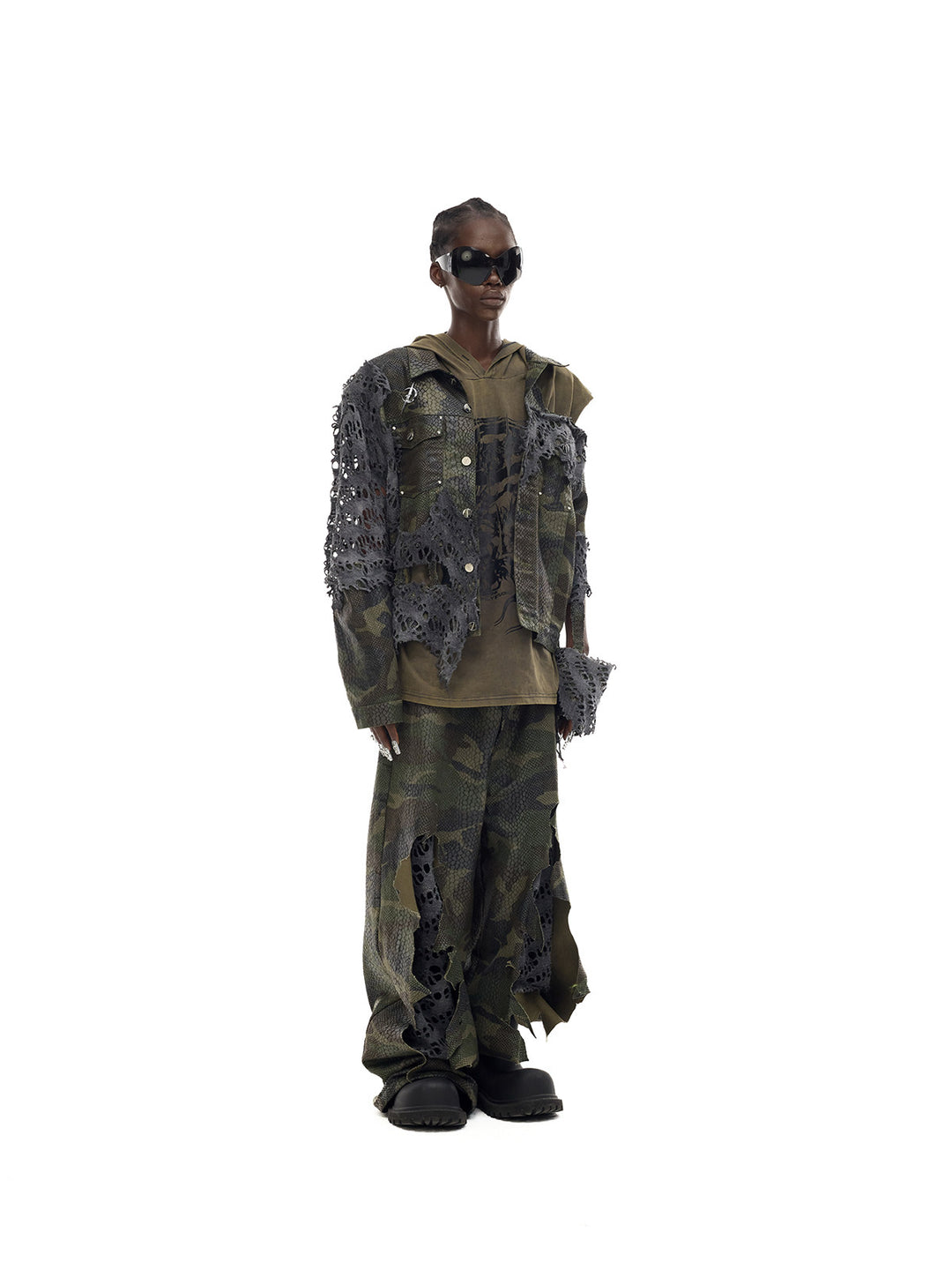 PINKSPINK ELECTRIC MOON distressed camouflage denim jacket — angled full-length modeled view layered over an olive top