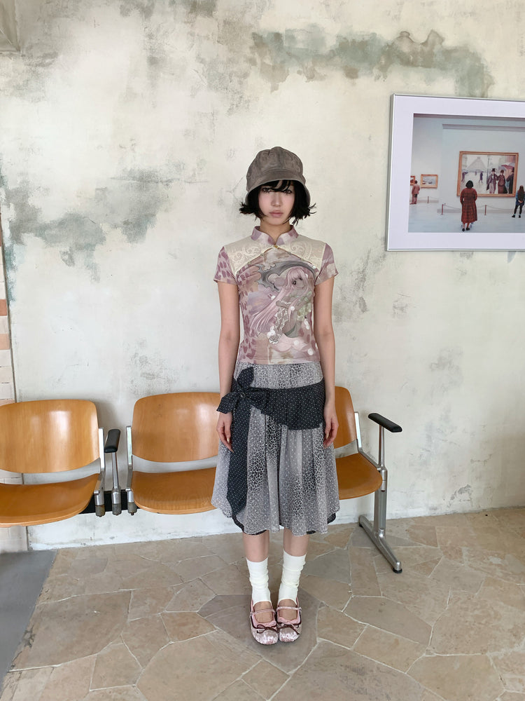 4RE1GN PINK REAPER lace-panel mandarin tee in pink multicolor — full-length front modeled view with arms relaxed and gray skirt