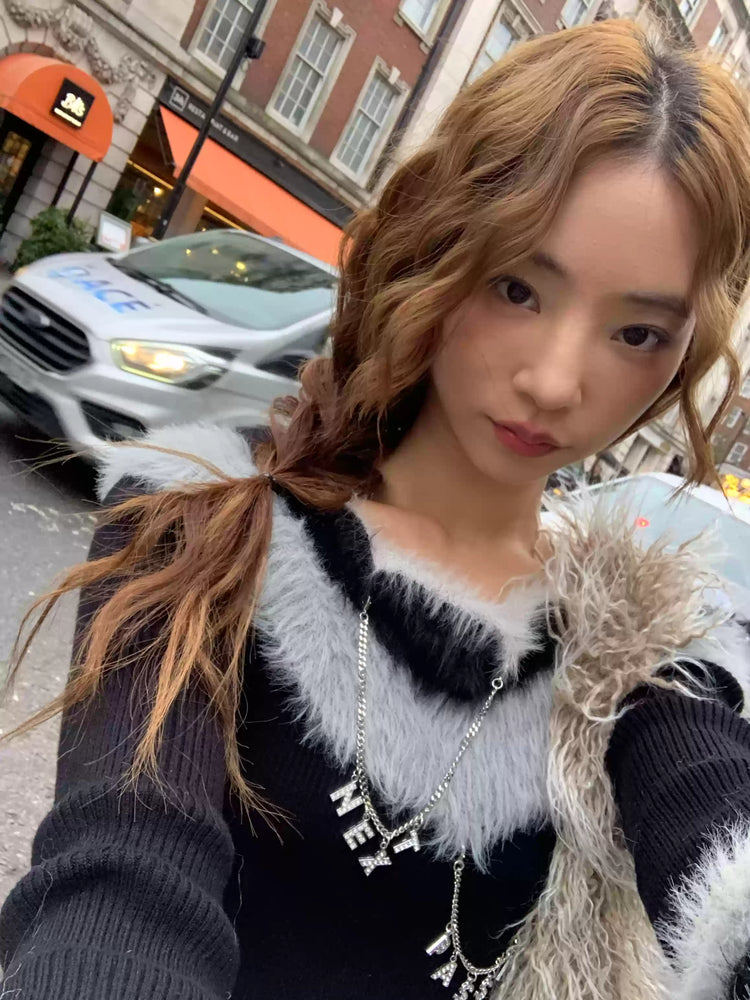 Next Passport black faux-fur collar knit pullover close-up