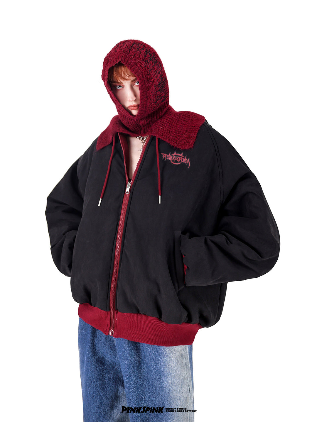 PINKSPINK ELECTRIC THORN embroidered knit balaclava in burgundy — three-quarter modeled view with a black and burgundy varsity hoodie