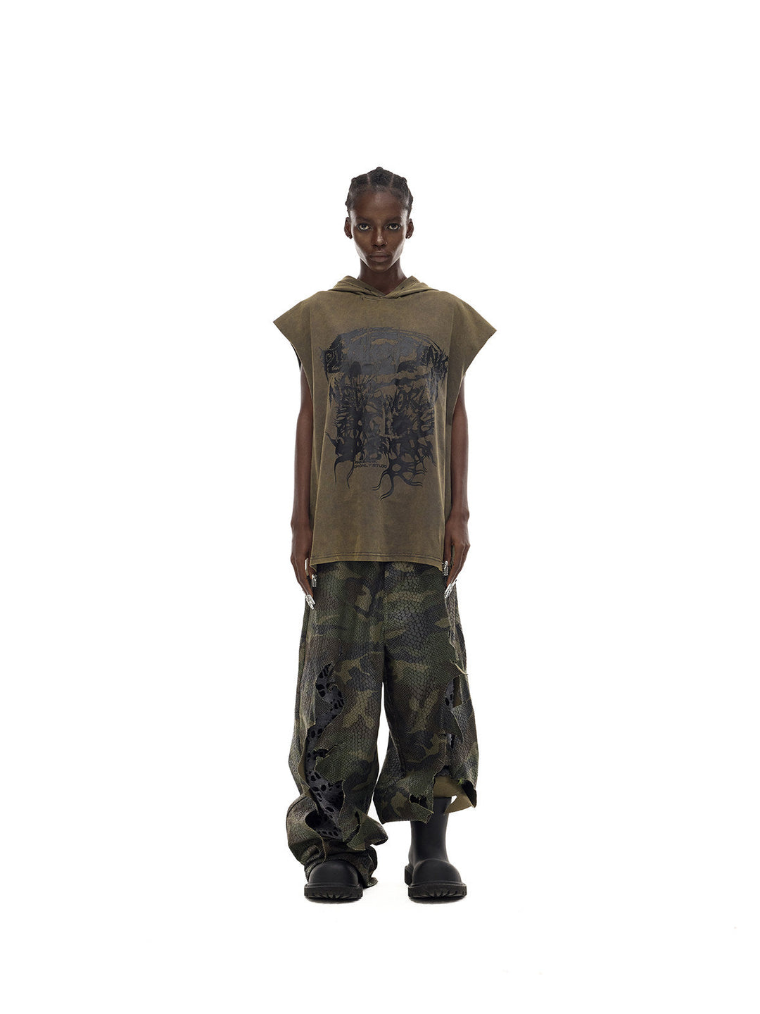 PINKSPINK DOUBLE STACK distressed camouflage wide-leg jeans — straight-on full-length modeled view with an olive sleeveless top