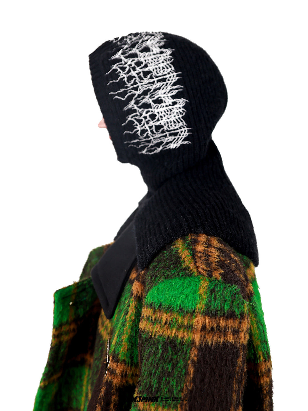 PINKSPINK ELECTRIC THORN embroidered knit balaclava in black — side modeled close-up with a green plaid coat