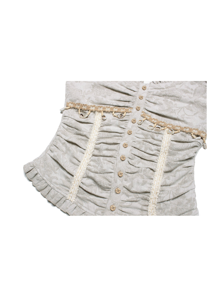 4RE1GN SHELL jacquard blouse and lace skirt separates in ivory — close-up of the blouse waist and ruffled hem