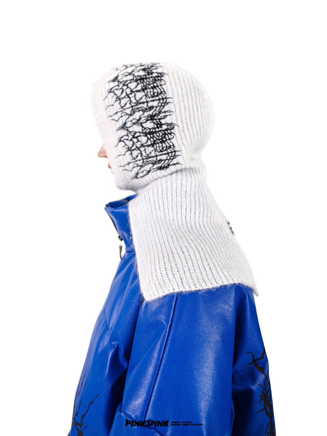 PINKSPINK ELECTRIC THORN embroidered knit balaclava in white — side modeled close-up with a blue puffer