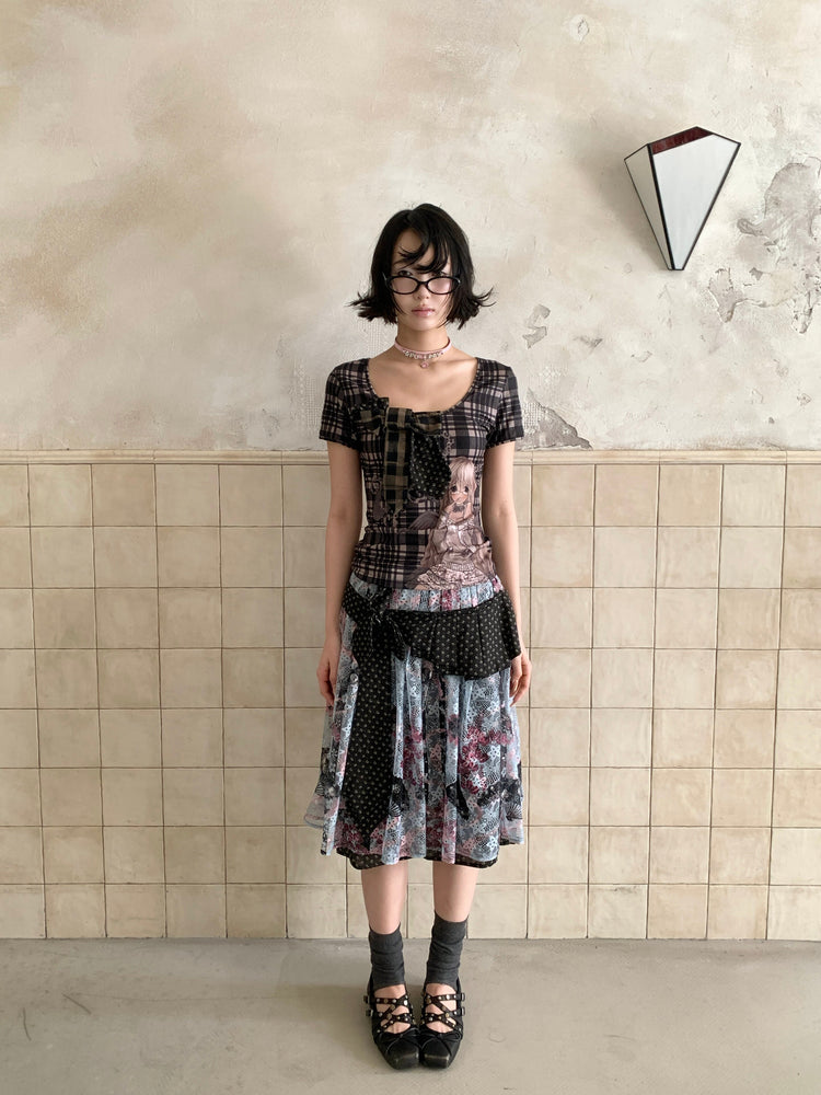 4RE1GN CROSS RIBBON jacquard lace layered skirt in multicolor — straight front modeled view beside a tiled wall