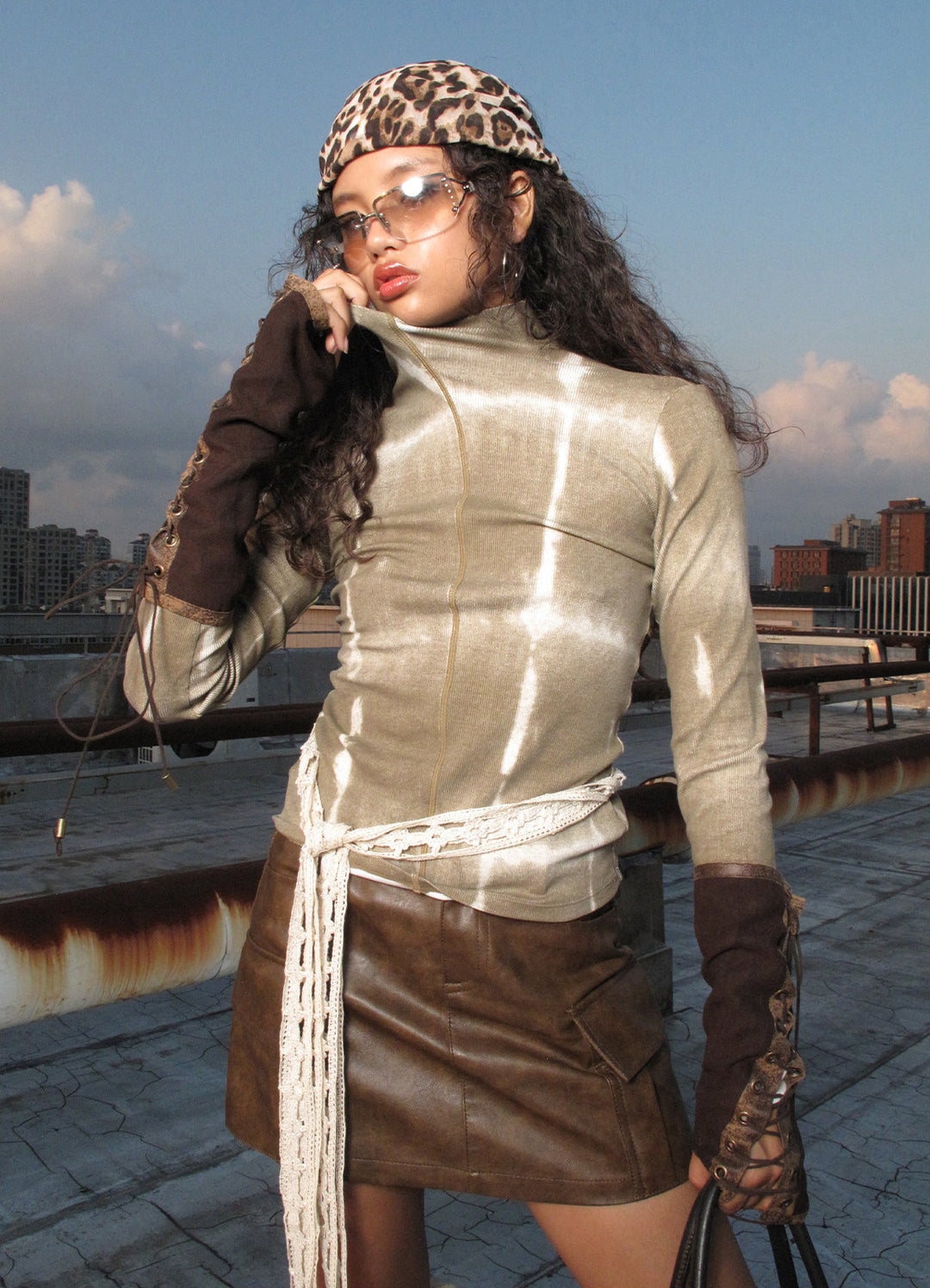 NEXT PASSPORT brown fitted mock-neck long-sleeve tee rooftop styling view.