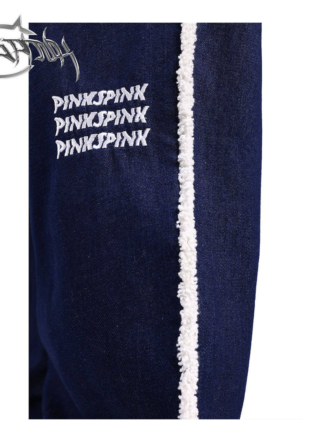PINKSPINK fleece-striped wide-leg jeans — close-up of the embroidered logo and white fleece stripe