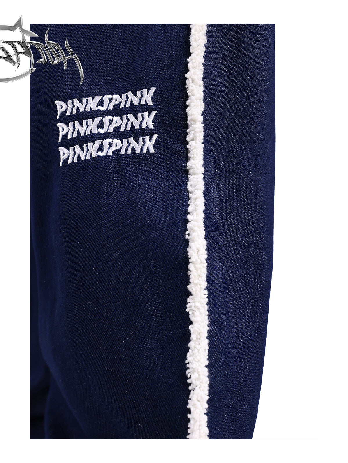 PINKSPINK fleece-striped wide-leg jeans — close-up of the embroidered logo and white fleece stripe
