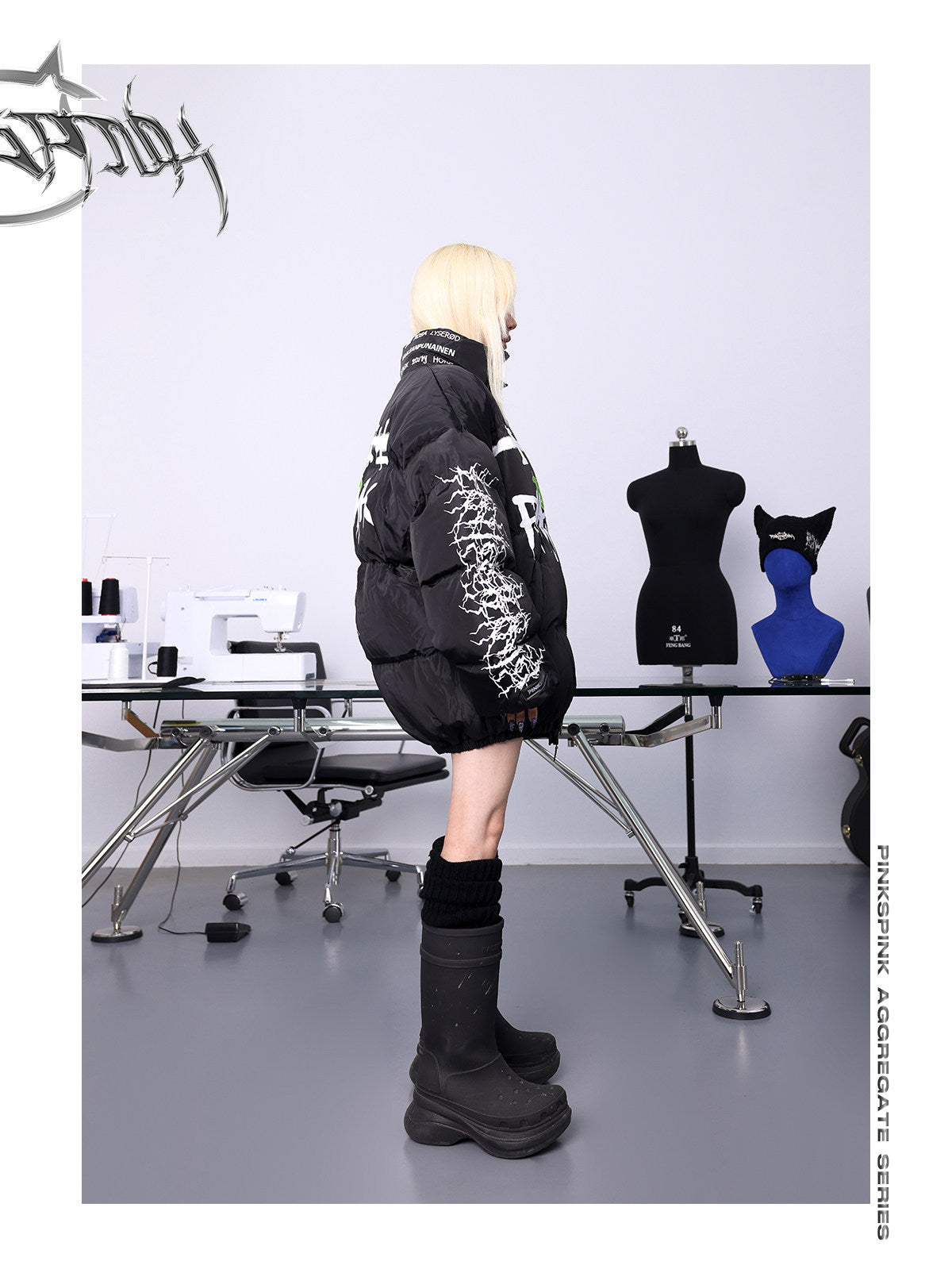 PINKSPINK GRAFFITI oversized padded jacket — side full-length modeled view showing the white branch-print sleeve