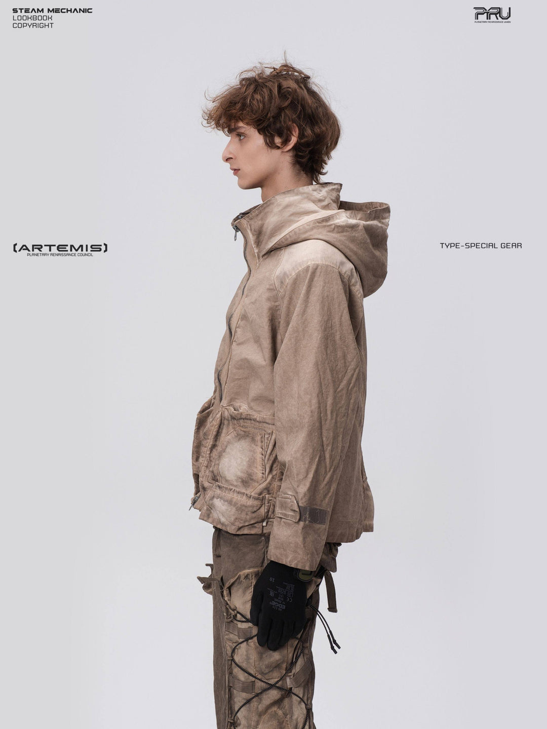 STARCORE distressed work jacket in gravel brown — side modeled close-up showing the hood and adjustable cuff