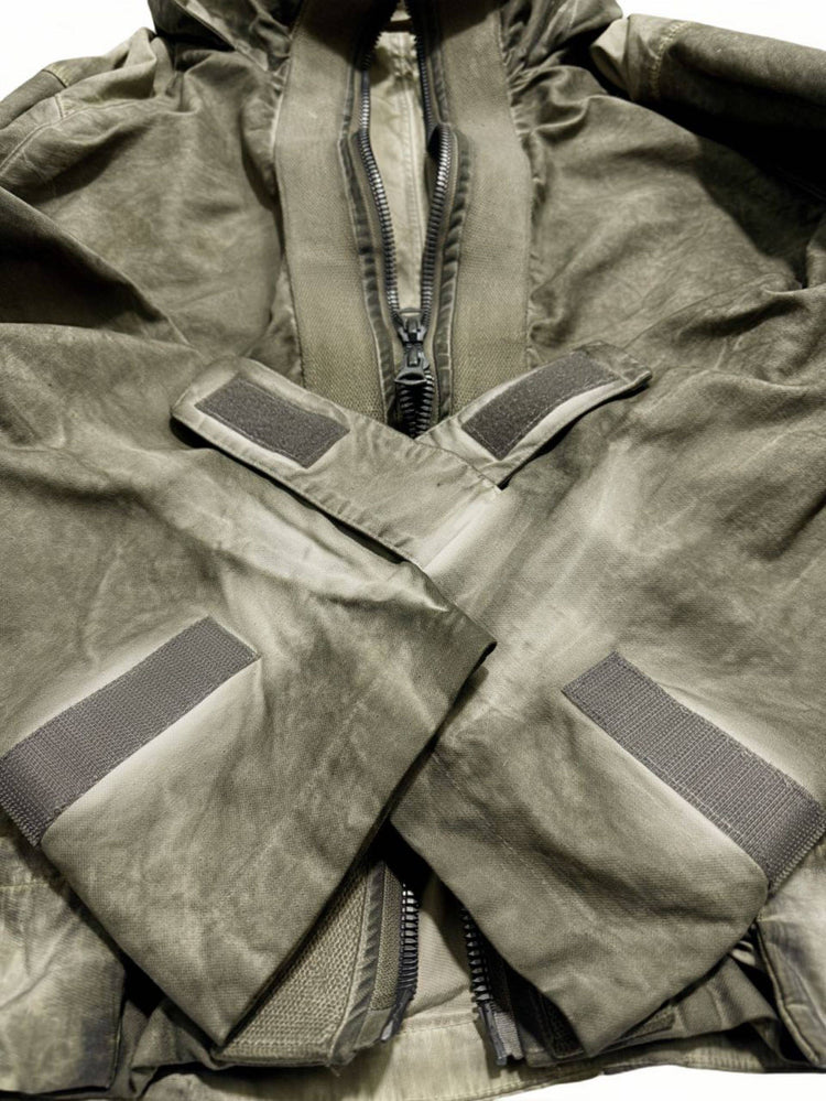 STARCORE distressed work jacket in lunar soil green — close-up of adjustable hook-and-loop cuffs and two-way zipper