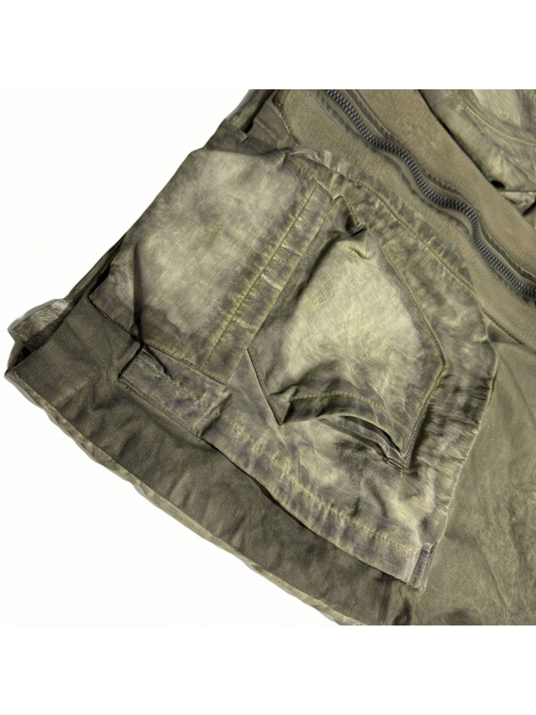 STARCORE distressed work jacket in lunar soil green — close-up of layered front pocket construction