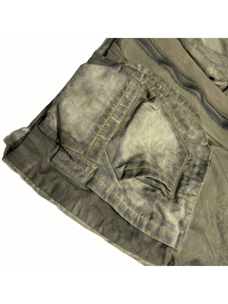 STARCORE distressed work jacket in lunar soil green — close-up of layered front pocket construction