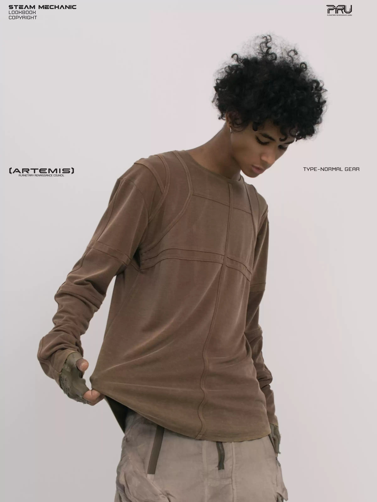 RUSTED ORBIT petrified brown mesh-panel long-sleeve top — front modeled close-up with hem extended