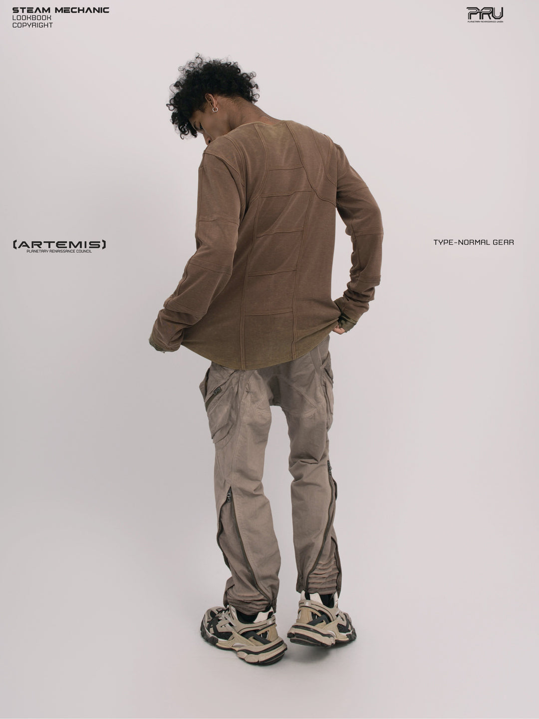 RUSTED ORBIT petrified brown mesh-panel long-sleeve top — full-length rear modeled view showing the shaped hem