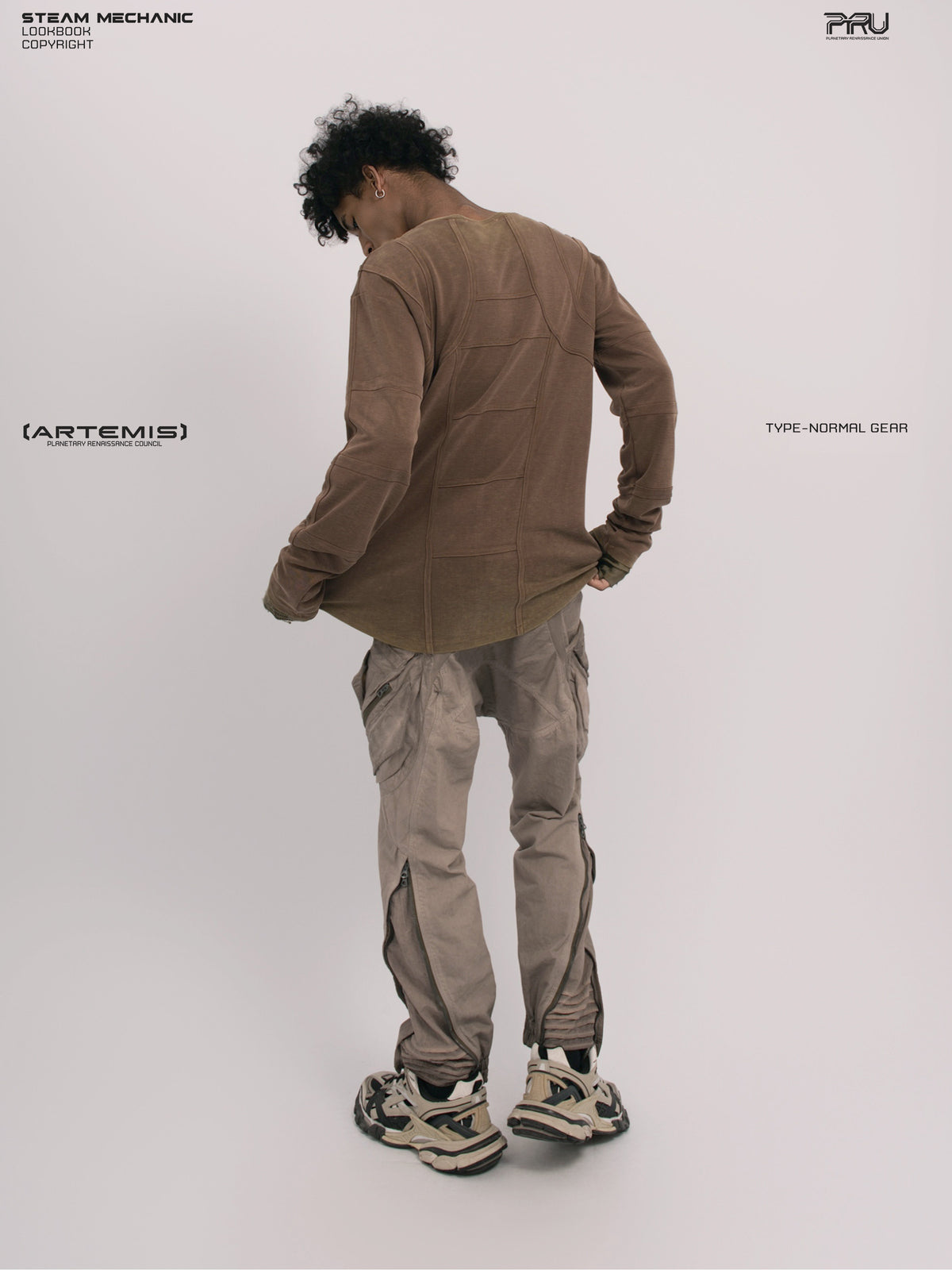 RUSTED ORBIT petrified brown mesh-panel long-sleeve top — full-length rear modeled view showing the shaped hem