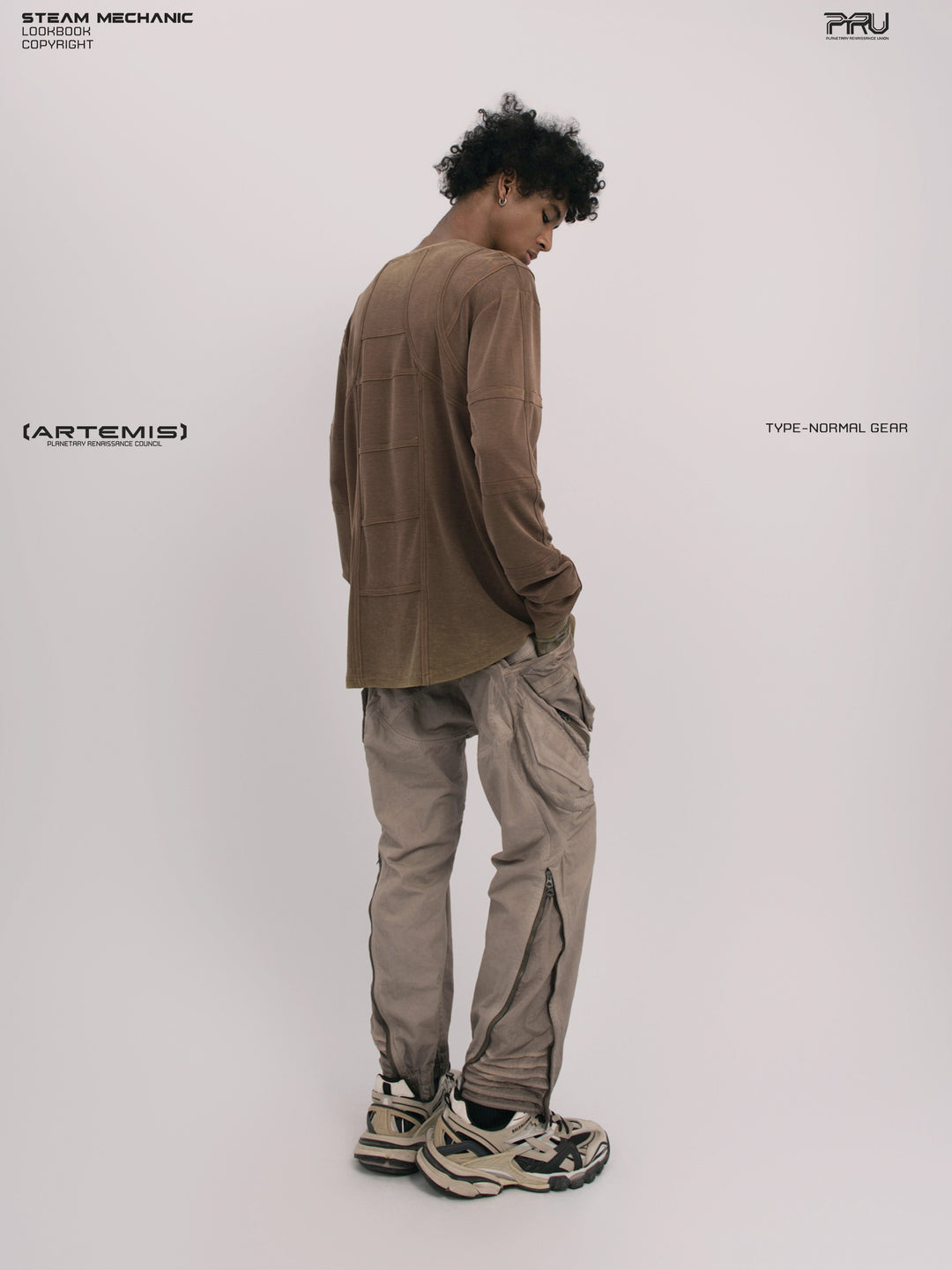 RUSTED ORBIT petrified brown mesh-panel long-sleeve top — full-length rear three-quarter modeled view