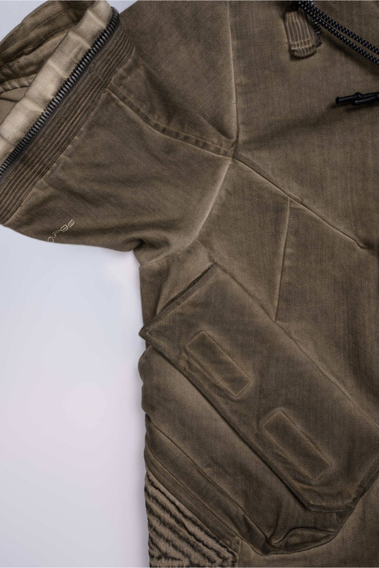 PIONEER mercury-brown detachable-sleeve jacket — vertical detail of the front pocket and geometric zipper pull