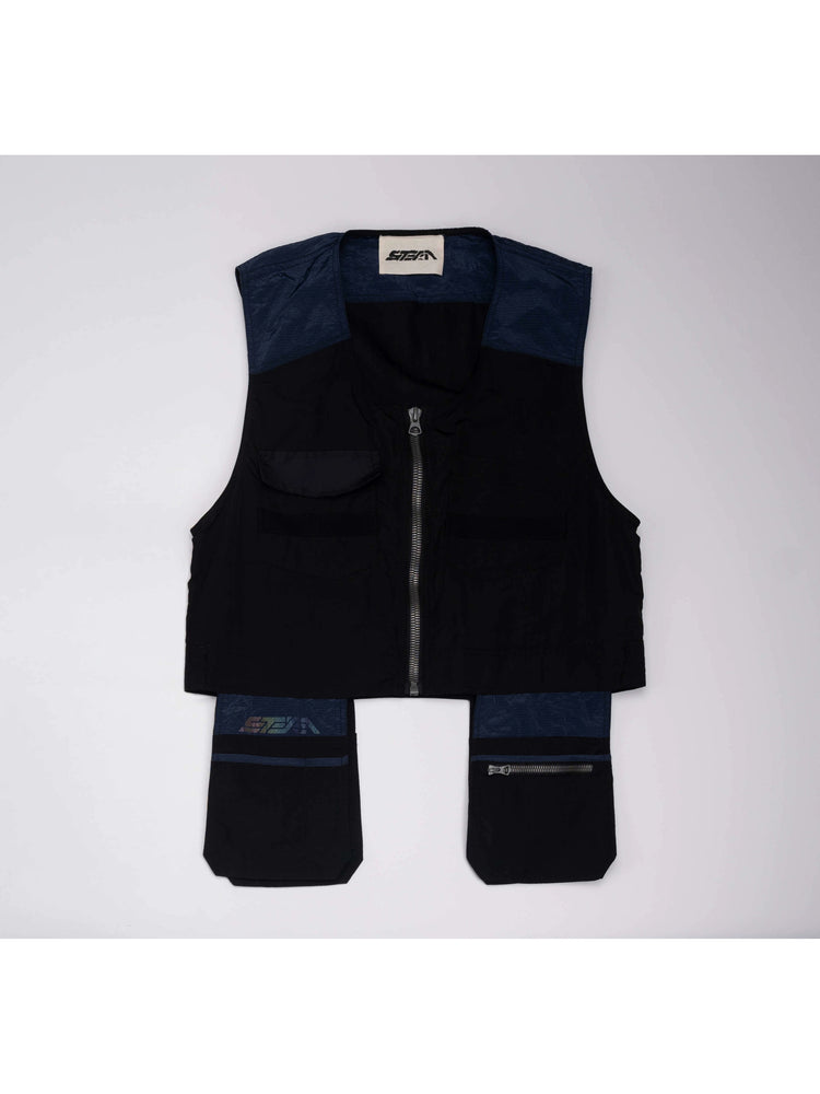PIONEER stardust black multi-pocket technical vest — front flat-lay showing the blue contrast panels and offset pockets