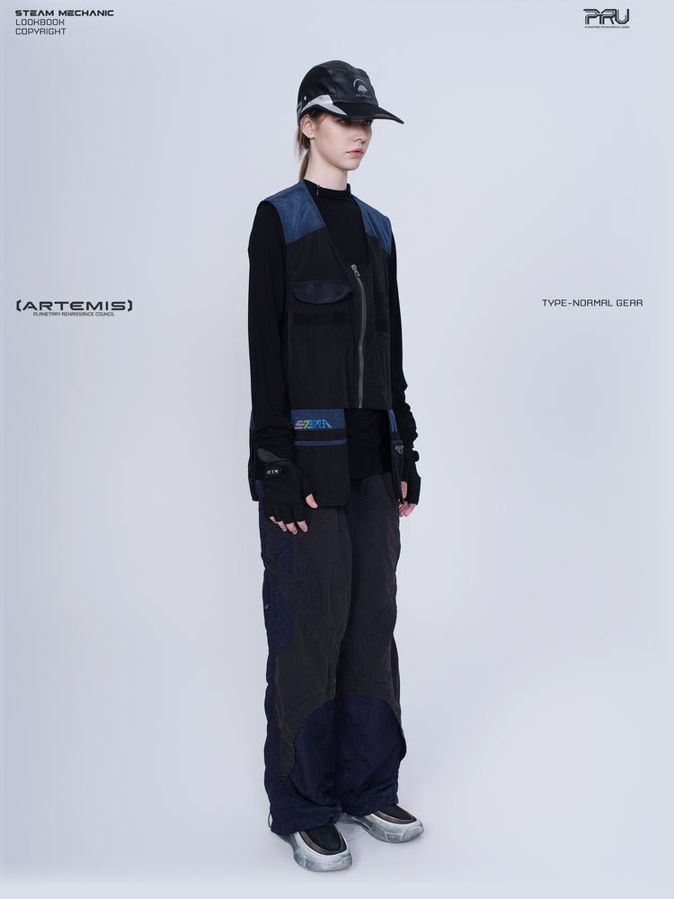 PIONEER stardust black multi-pocket technical vest — full-length modeled three-quarter view showing the pocket arrangement