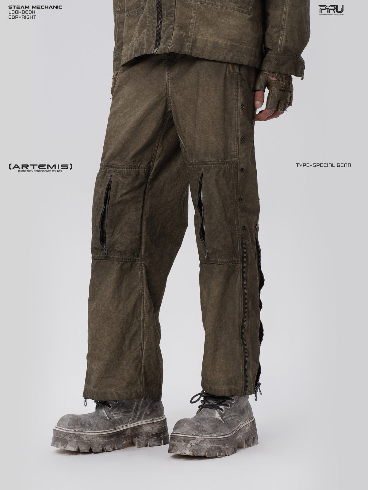 PIONEER knee-mesh utility work pants in lunar soil green — three-quarter modeled close view showing outer-leg eyelets