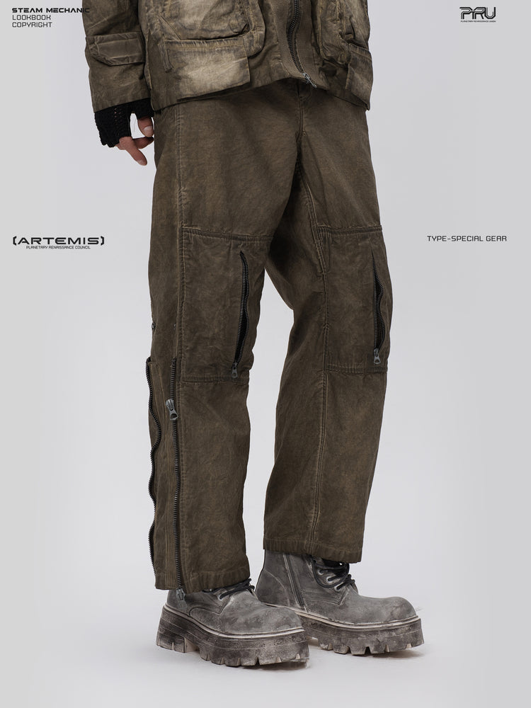 PIONEER knee-mesh utility work pants in lunar soil green — three-quarter close view showing both knee zippers and outer-leg hardware