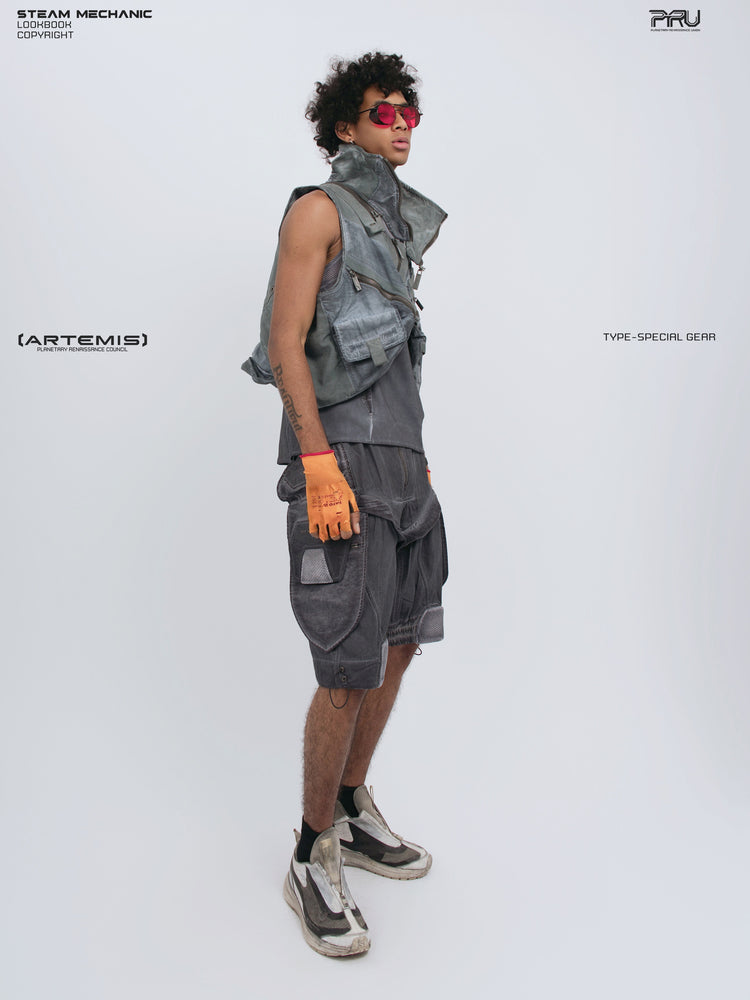 ARTEMIS stellar blue detachable technical shorts — side-front full-outfit view styled with a cropped utility vest