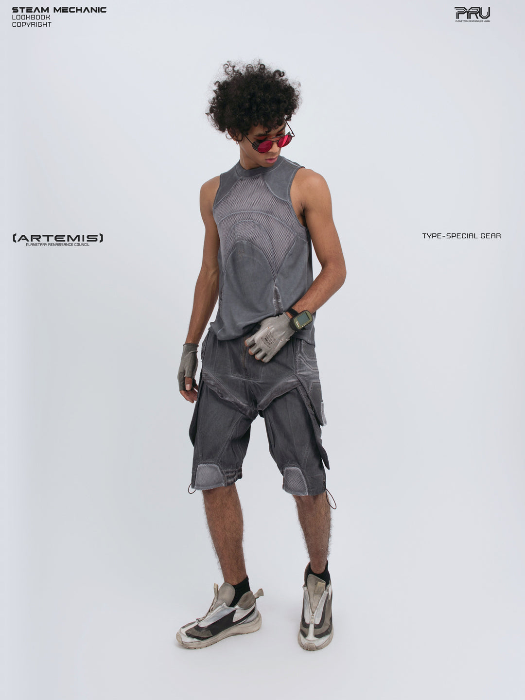 ARTEMIS stellar blue detachable technical shorts — opposite front three-quarter full-outfit view showing the cargo pockets